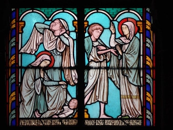 This picture shows Saint Genevieve depicted in one of Notre-Dame de Paris' windows