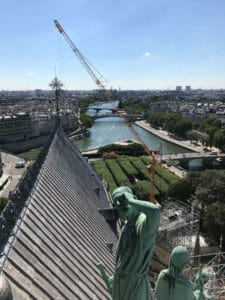 This is a picture of Notre-Dame Cathedral's rooftop before the fire struck in 2019. You can see the roof from the spire.